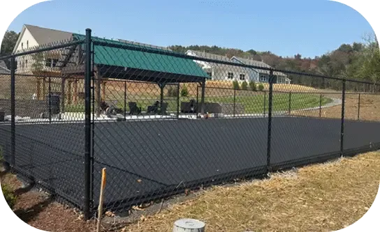 A fenced court at an amenity center built by LawnValue
